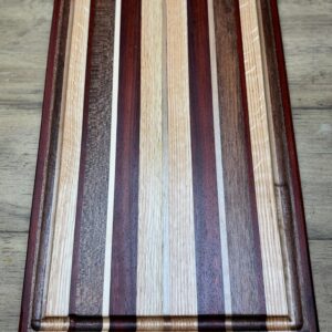 Padauk, Red Oak, African Mahogany & Maple cutting board 18x12x1.25 with juice groove and non slip rubber feet  $115